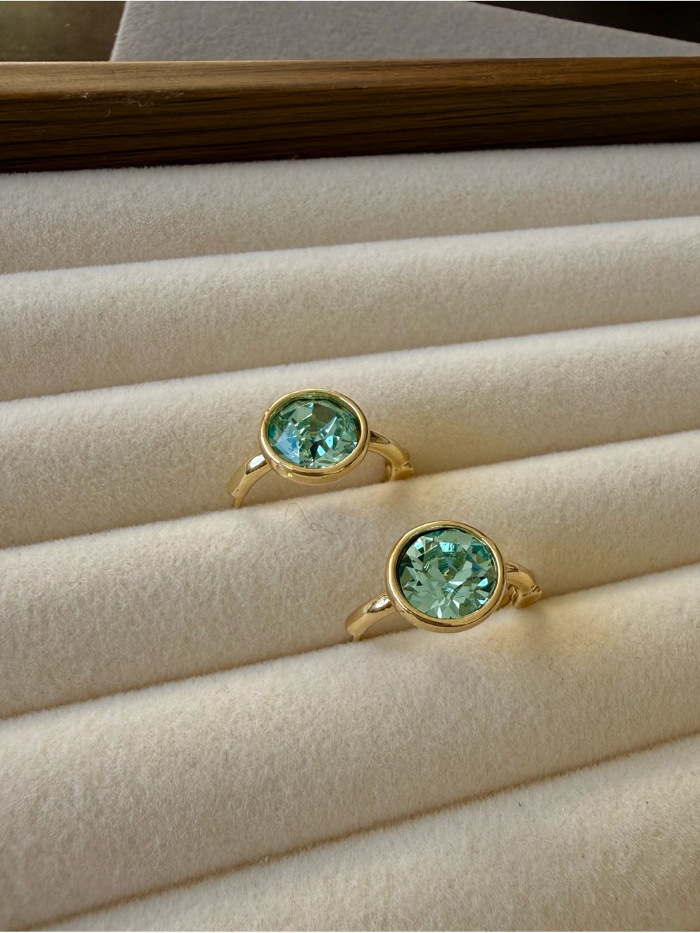 Gold tone dainty huggie with Mint Green CZ Center - Women's Jewelry